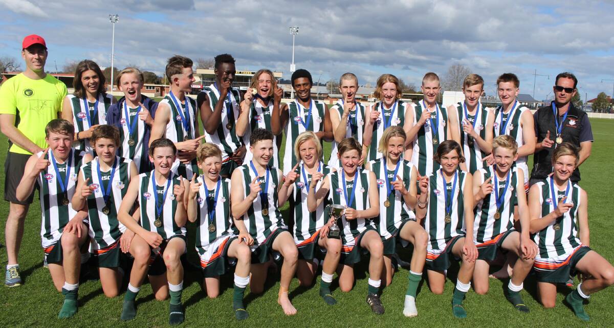 NUMBER ONE: The Riverina Anglican College's under 15 team after taking out the AFL NSW-ACT Giants Cup in Albury on Tuesday. Picture: Sarah Braybon
