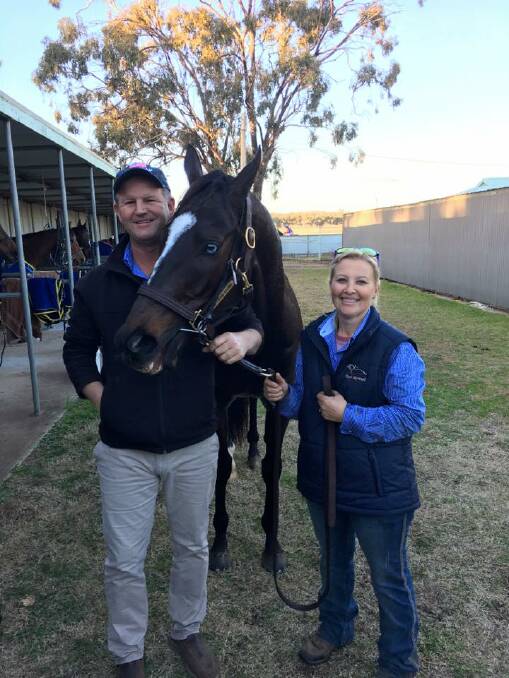 HAPPY DAYS: Wagga trainer Chris Heywood and strapper Cindy Browne with Leucura after his all-the-way win at Narrandera on Sunday. 