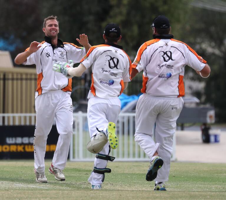 GOT HIM: Wagga RSL's Jake Hindmarsh celebrates a wicket with teammates during the win over Wagga City at Robertson Oval. Picture: Les Smith