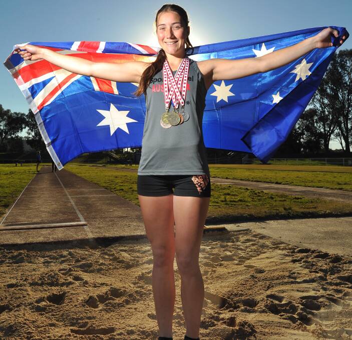 BRIGHT FUTURE: Wagga teenager Ellen McIntyre proudly displays the five medals she won at meets in Canada last month. Picture: Kieren L Tilly