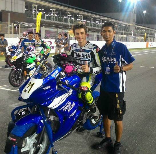 THUMBS UP: Brandon Demmery and his spanner man Okka at the Qatar round of the Asian Road Racing Championship last week.