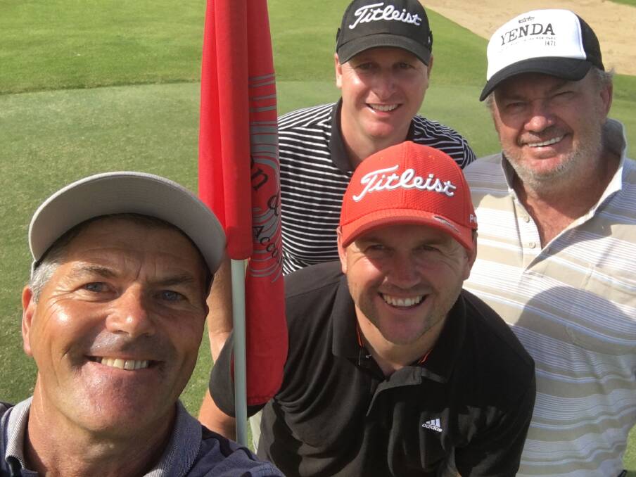 RARE FEAT: Peter Zotti, Kane Harding, Andrew Wise and Greg King celebrate their birdies at the 18th hole at the Wagga Country Club.