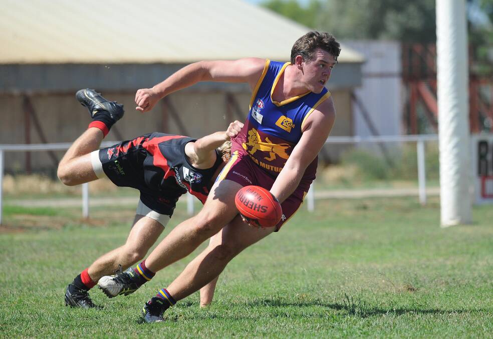 STRONG: Ganmain-Grong Grong-Matong's Jack McCaig looks to shrug off a Rhys Mooney tackle in Sunday's trial. Picture: Laura Hardwick