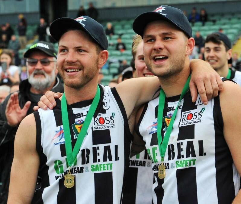 BIG SIGNING: Glenorchy forward Daniel Muir (right) enjoys their grand final victory with Josh Arnold. Muir has signed with Leeton-Whitton as assistant coach. Picture: The Examiner