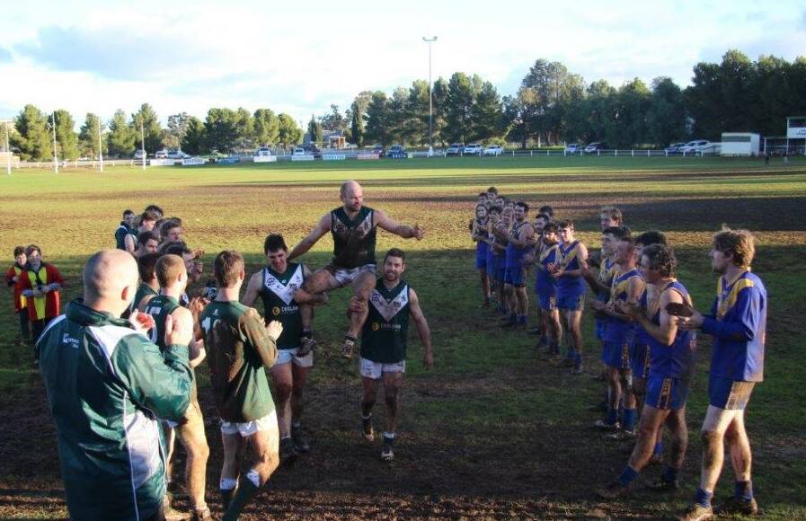 MILESTONE MAN: Coolamon captain Jamie Maddox is chaired off to a guard of honour at Kindra Park on Saturday.