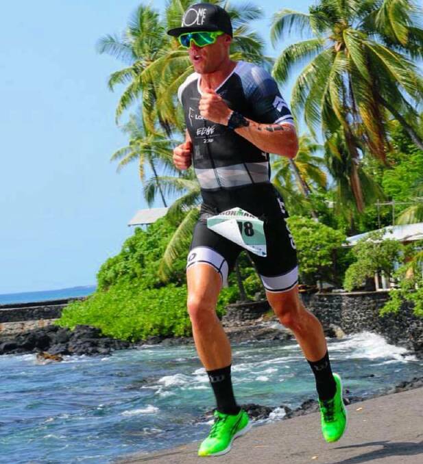 TOP EFFORT: Wagga triathlete Ryan Miller bounds along during the run leg of the Ironman World Championships at Kona on Sunday. 