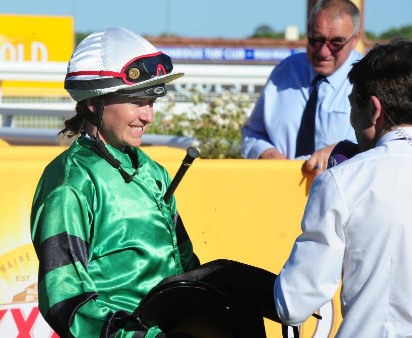 ALL SMILES: Canberra apprentice Carly Frater prepares to talk to John Scorse after winning the last race at Wagga on Monday. Picture: Kieren L Tilly