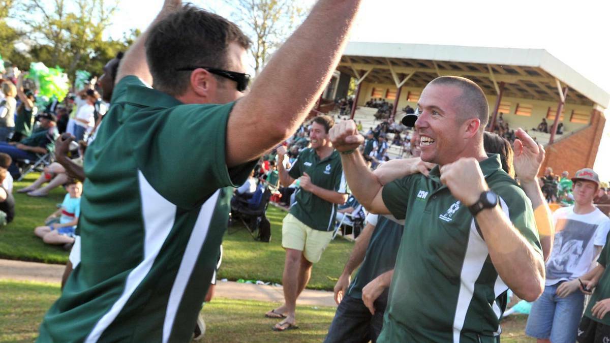 DONE IT BEFORE: Coolamon coach Matt Hard (right) celebrates the 2013 premiership win. 