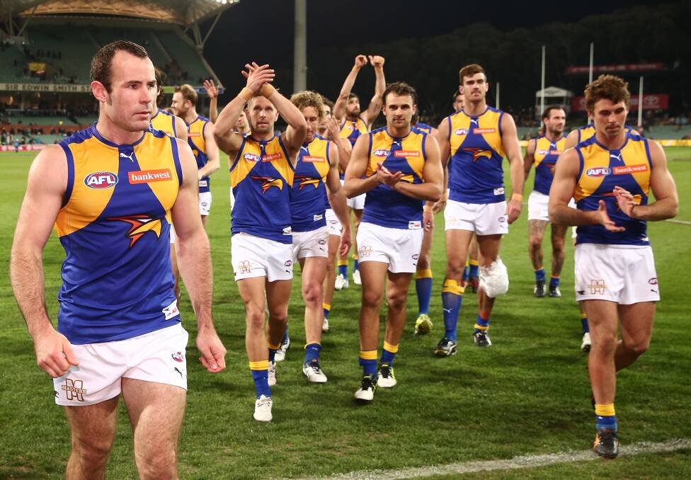 WILL TRAVEL: West Coast captain Shannon Hurn leads the Eagles from the field after last year's final round win over Adelaide at Adelaide Oval. Picture: Getty Images