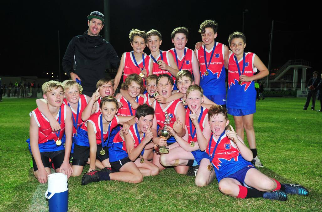 TOP EFFORT: Henschke Primary School celebrate their Paul Kelly Cup final win at Robertson Oval on Monday night. Picture: Kieren L Tilly