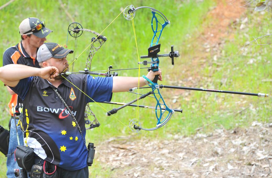 SERIOUS BUSINESS: Victoria's Lee Solomon (right) and Bathurst's Daniel McNamara during the World Field Archery Championships on Monday. Pictures: Kieren L Tilly