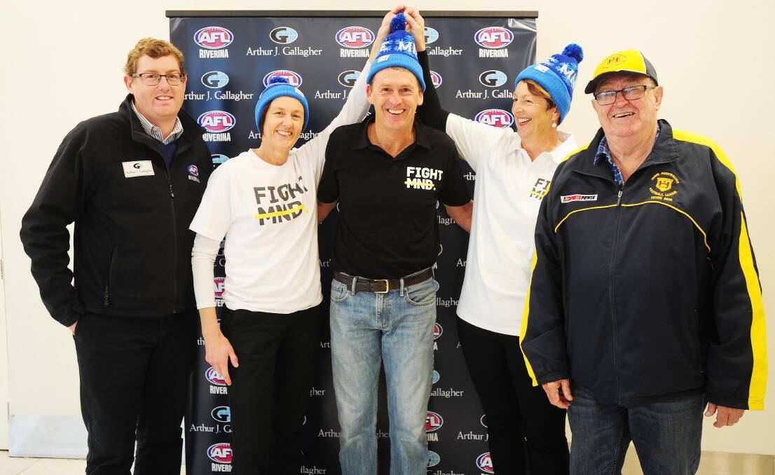 ALL SMILES: AFL Riverina chairman Michael Irons, Julie Cornell, Chris Daniher, Dorothy Vearing and Hume League official Barry Malone at the 'Sock it to MND' launch. Picture: Kieren L Tilly