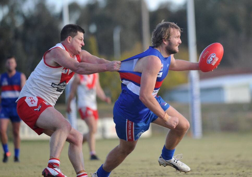 GOTCHA: Griffith's Mick Duncan reels in Turvey Park's Clint Shields in the Riverina League game at Maher Oval on Saturday. Picture: Laura Hardwick