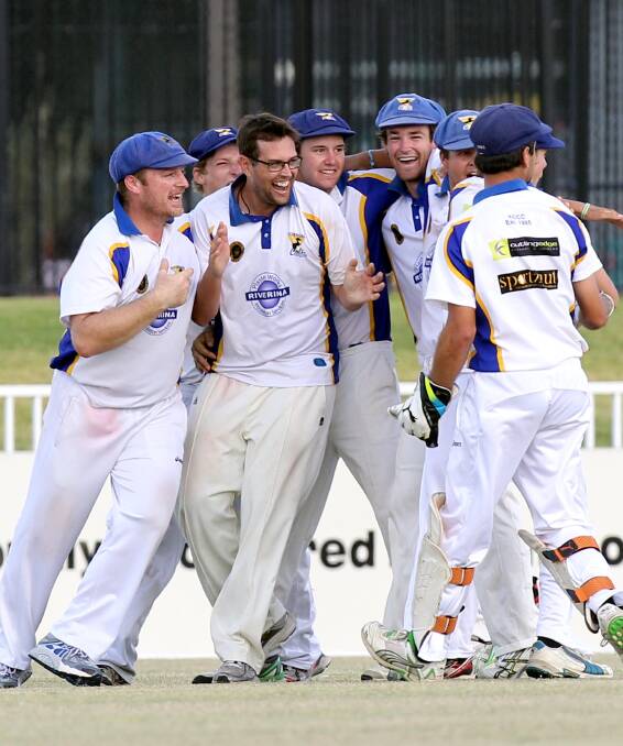 WE DID IT: Kooringal Colts players celebrate the final wicket that gave them a grand final victory over South Wagga. Picture: Les Smith