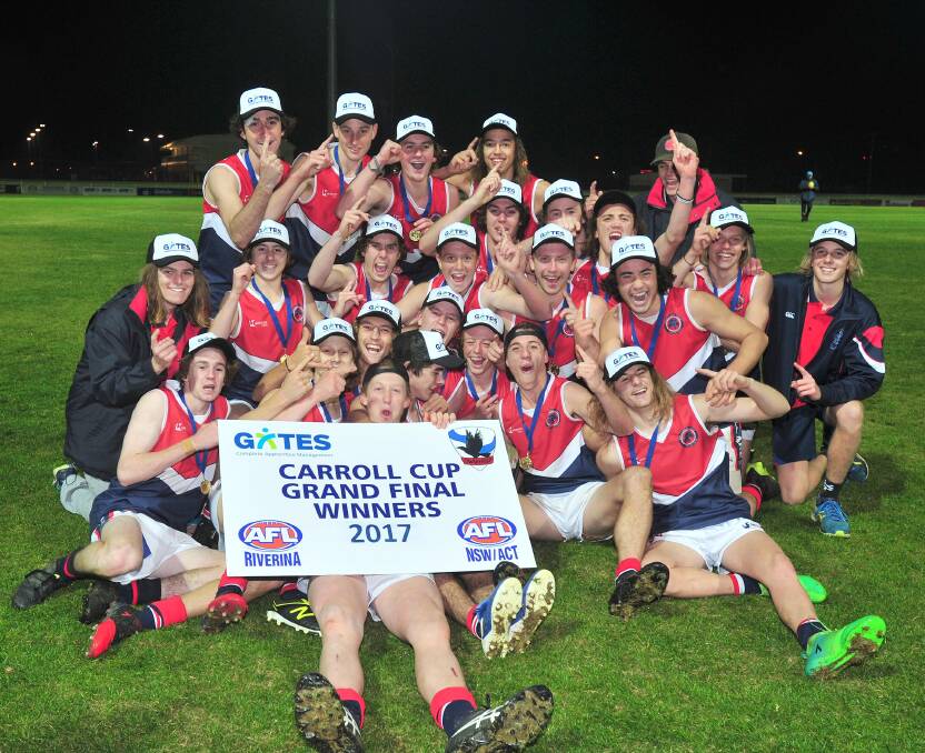 WINNERS: Kildare Catholic College celebrate their Carroll Cup victory over Mater Dei Catholic College on Monday night at Robertson Oval. Picture: Kieren L Tilly