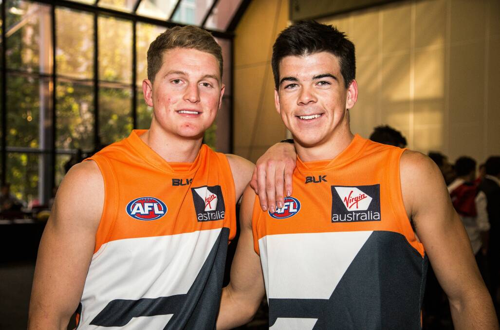 GIANTS: Jacob Hopper and Matt Kennedy show off their new colours at the AFL Draft in Adelaide on Thursday night. Picture: GWS Giants