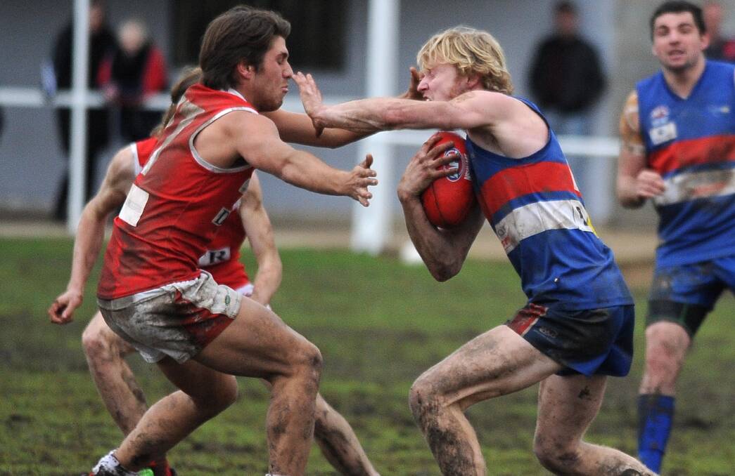 DON'T ARGUE: Turvey Park's Lachlan McRae fends off Collingullie-Glenfield Park's Tom Pocock at Maher Oval on Saturday. Picture: Laura Hardwick