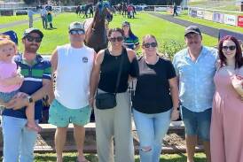 Some happy owners, in front of Future Fund and trainer Maddy Collins, celebrate the win at Murrumbidgee Turf Club on Thursday. Picture by Murrumbidgee Turf Club