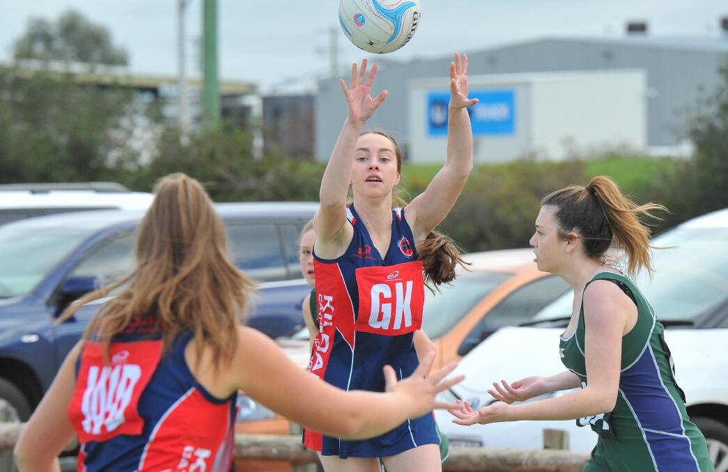 INCOMING: Kildare Catholic College's Emma van der Rijt gets a pass away against Albury's Xavier High School at Equex Centre on Tuesday. Picture: Kieren L Tilly