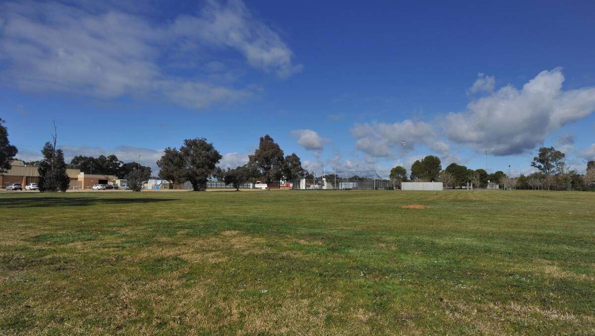 TRANSFORMATION: The site where the new Rules Club Motel will be built and where cars have traditionally parked for the Farrer League grand final.