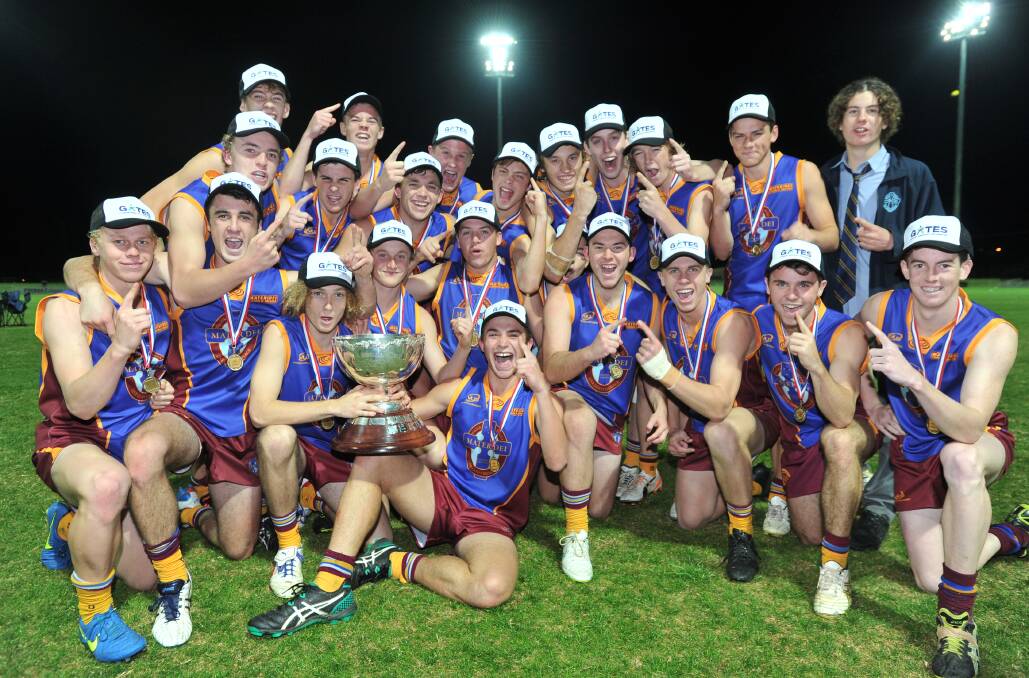 BACK-TO-BACK: Mater Dei Catholic College players celebrate their Carroll Cup victory at Robertson Oval on Wednesday night. Picture: Laura Hardwick