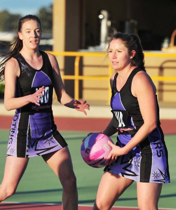 OPTIONS: Shooting Stars wing attack Jenee West looks for options with teammate Ruby Gooden in support during Saturday's A grade major semi-final at Wagga Netball Centre. Picture: Kieren L Tilly