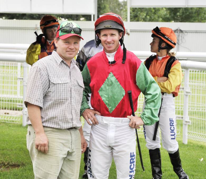 CAREER HIGHLIGHT: Brad Clark is all smiles with Rob Anderson after the win of Chloe's Puppet at Wagga last year.