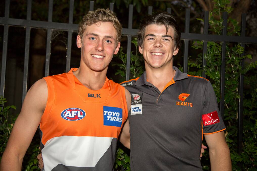 WELCOME ABOARD: Harry Perryman (right) is welcomed to Greater Western Sydney (GWS) by former Collingullie teammate Matt Kennedy at Friday night's AFL Draft in Sydney. Picture: Craig Abercombie, GWS Giants