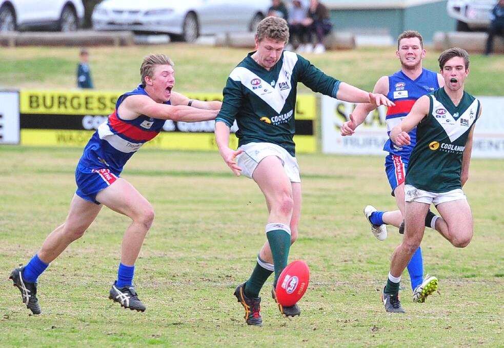 ON THE ATTACK: Coolamon's Joe Redfern gets boot to ball against Turvey Park at Maher Oval on Saturday. Picture: Kieren L Tilly