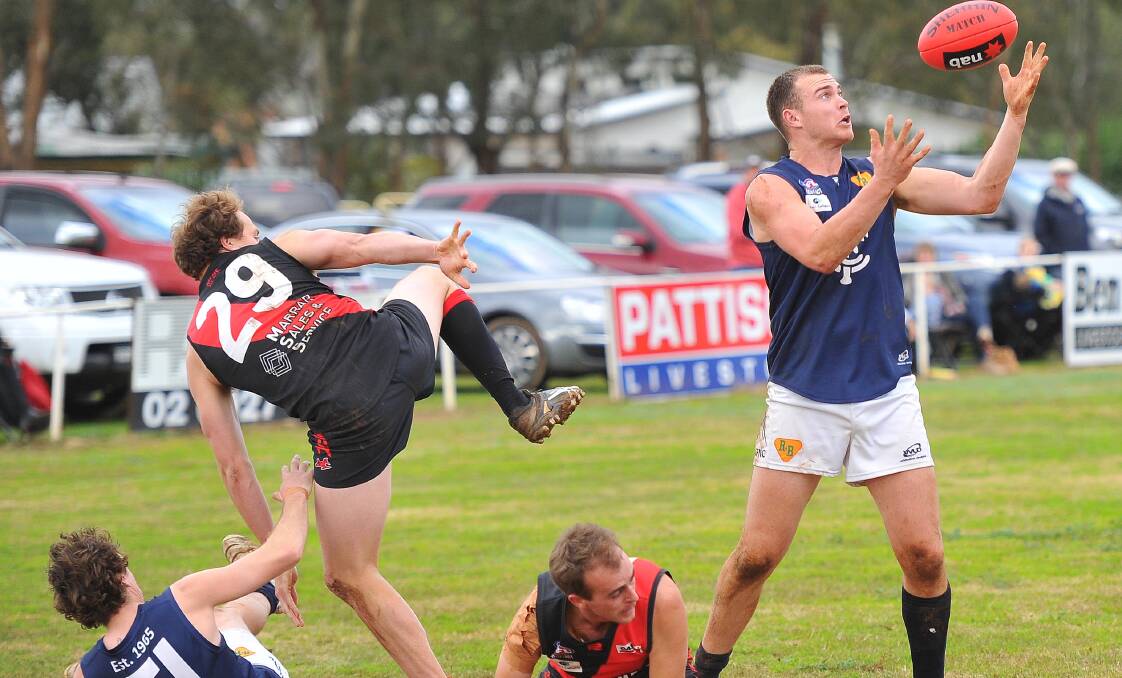 EYES ON THE PRIZE: Coleambally coach Josh Hamilton marks in front of Marrar's Nat Clark at Langtry Oval on Saturday. Picture: Kieren L Tilly