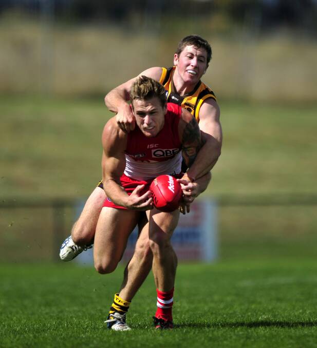 NEW ADDITION: Liam Greenwell in action for Tuggeranong against Sydney Swans' Tim Membrey in 2013. Picture: The Canberra Times