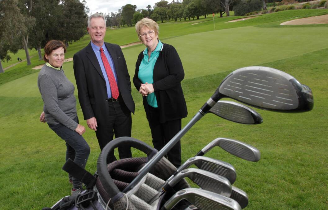 POSTPONED: Wagga Country Club's ladies captain Gemma Bromham, club captain Stephen Childe and Kilbrogan Trading's Janet Smith last week. Picture: Les Smith