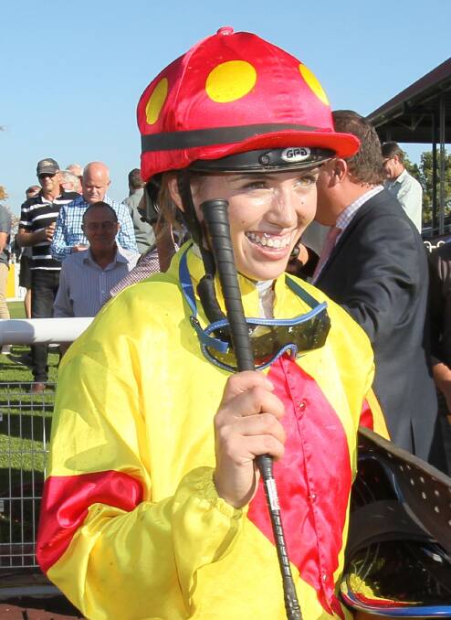ALL SMILES: Canberra jockey Kayla Nisbet after winning on Croix De Vie.