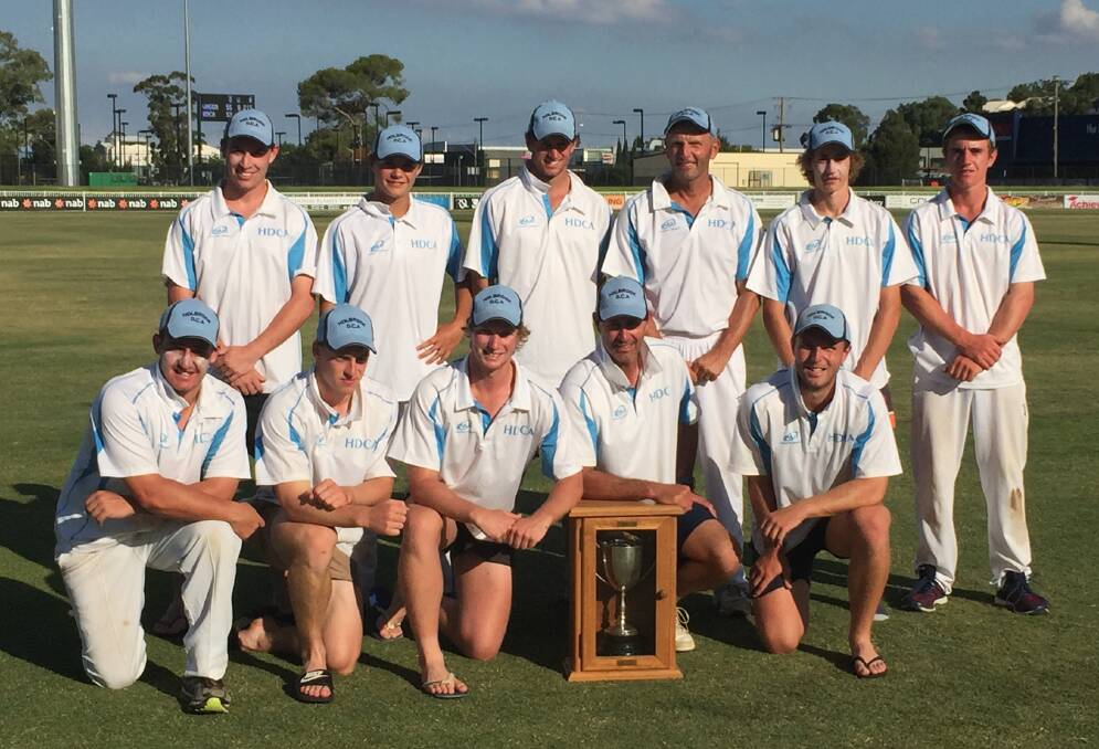 CHAMPIONS: Holbrook and District Cricket Association celebrate their historic O'Farrell Cup win over Wagga at Robertson Oval on Sunday. Picture: Matt Malone