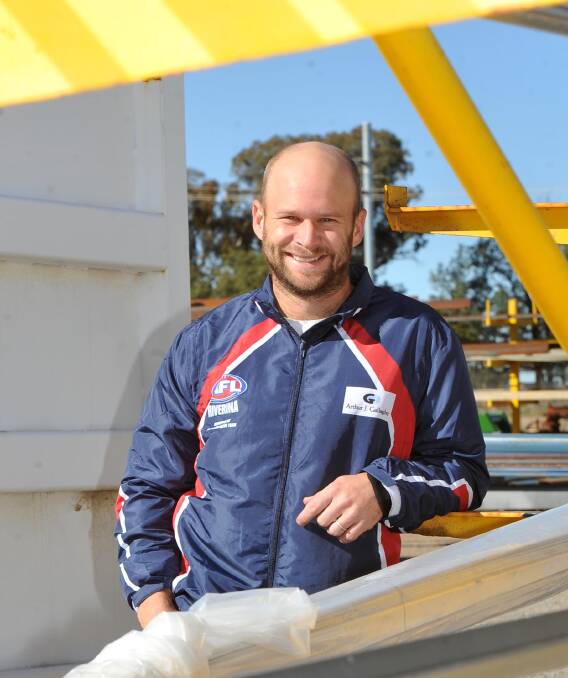 HONOURED: Jamie Maddox shows off the Riverina colours at work at Coolamon Steelworks on Friday. Maddox has been named captain of Riverina League's representative team. Picture: Laura Hardwick