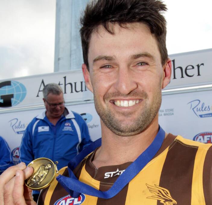 SPECIAL MOMENT: East Wagga-Kooringal captain Ben Absolum shows off the Nitschke-Schmidt Medal for best-on-ground in Saturday's Farrer League grand final. Picture: Les Smith