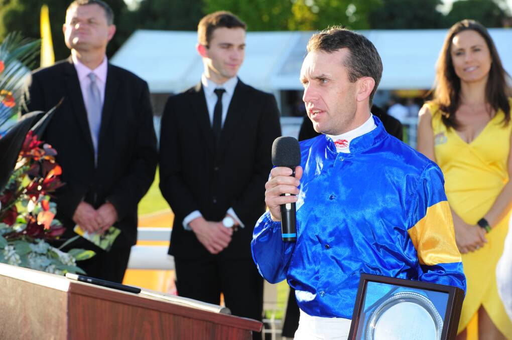 ON THE UP: Mark Pegus accepts his trophy for winning this year's Wagga Town Plate with the Lee and Anthony Freedman-trained Santa Ana Lane. Picture: Kieren L Tilly