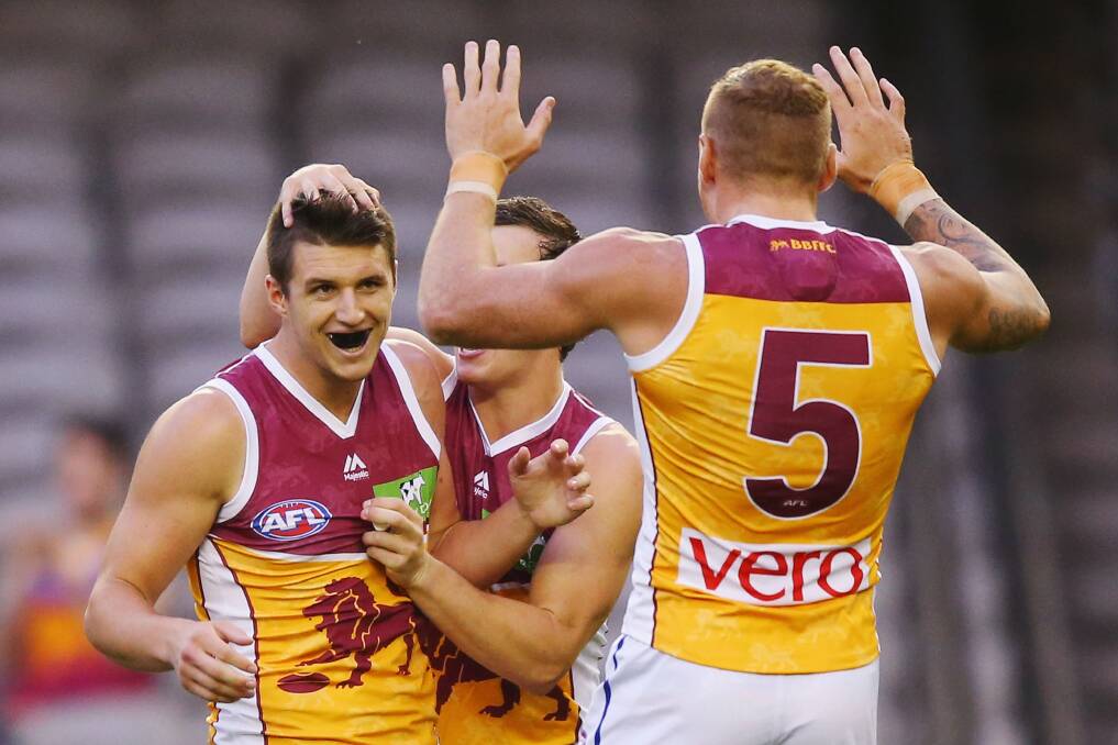 NEW HOME: Temora footballer Jake Barrett earns the praise of his teammates during a pre-season game for the Brisbane Lions. Picture: Getty Images
