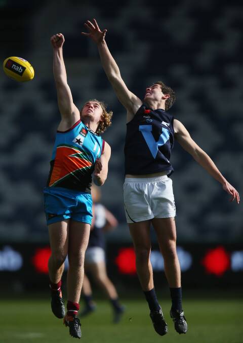 IN DEMAND: Wagga's Brendan Myers competes against Vic Metro's Patrick Naish during the under 18 championships at Simonds Stadium on July 5. Picture: Getty Images