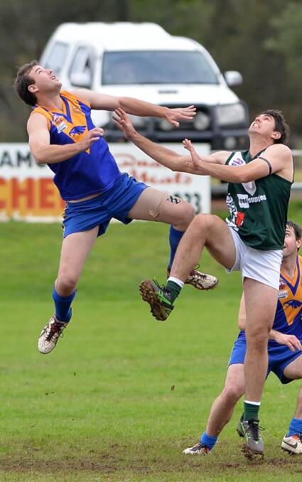 WELCOME BACK: Phil Aumann goes up in the ruck for Narrandera against Coolamon's Ben Edyvean, back in 2014. 
