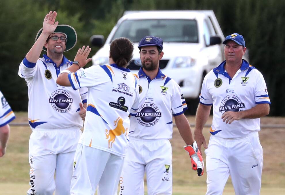 HAPPY DAYS: Kooringal Colts coach David Bolton celebrates a wicket with Macregor Hanigan against South Wagga at Harris Park on Saturday. Picture: Les Smith