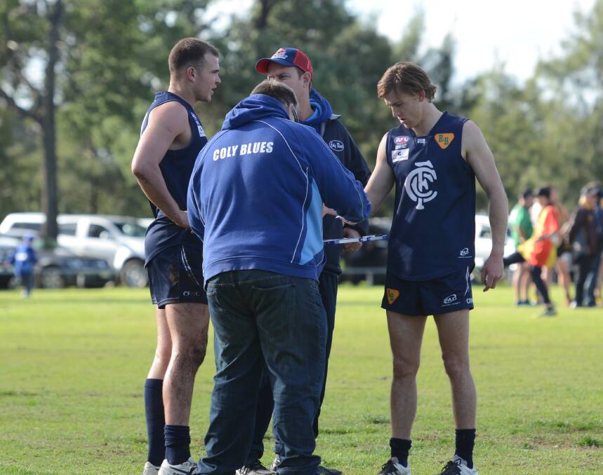 FREE TO PLAY: Coleambally captain-coach Josh Hamilton (left) talks with his coaching staff during last month's Farrer League clash against East Wagga-Kooringal. Picture: Riley Krause