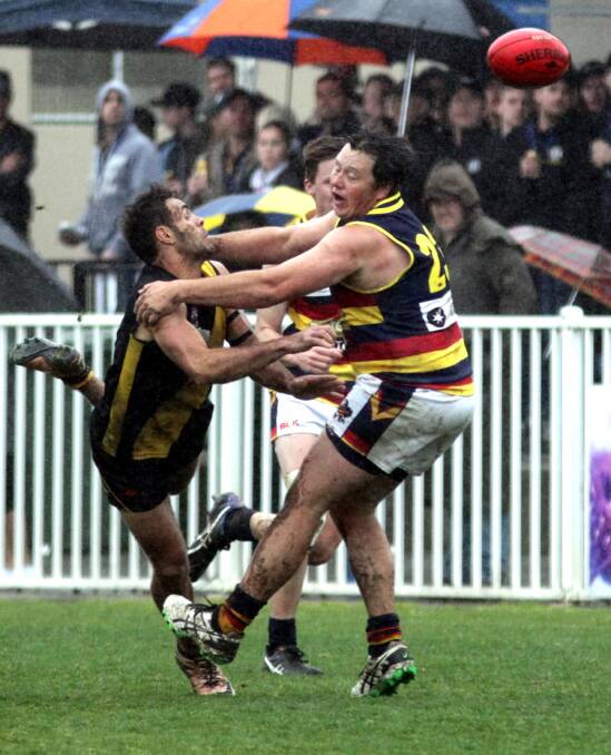 COLLISION: Wagga Tigers' Jesse Manton collides with Leeton-Whitton's Cam Griggs in the Riverina League grand final on Sunday. Picture: Les Smith