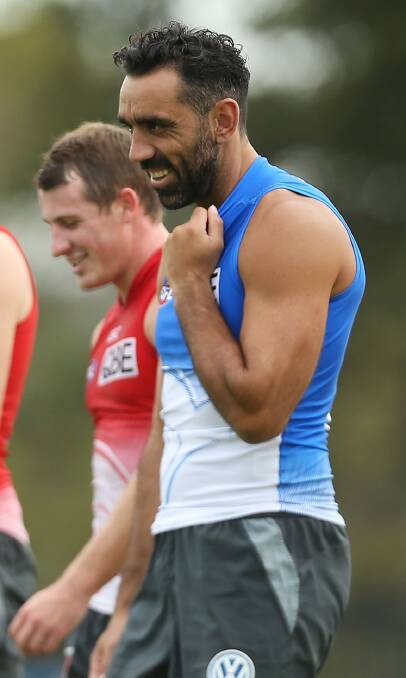 GOOD MATES: Adam Goodes and Harry Cunningham (left) share a laugh at training earlier in the year. 
