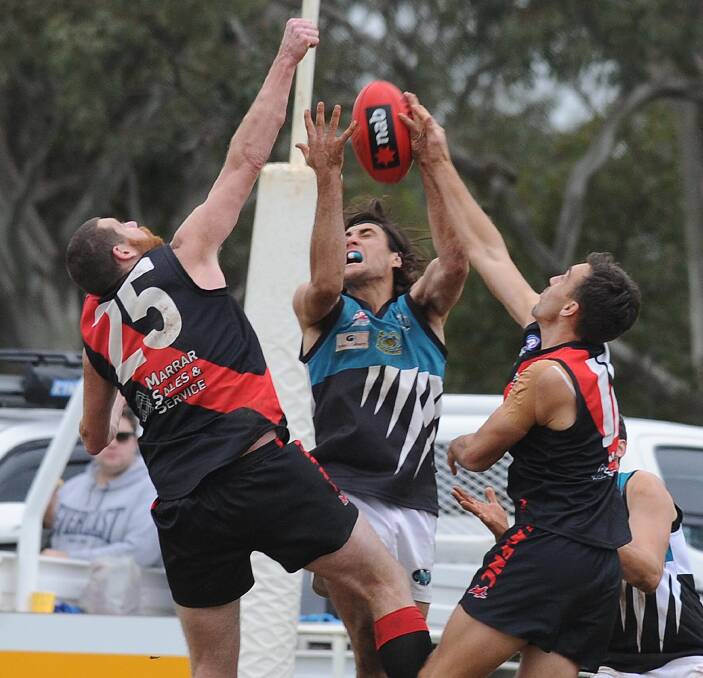 DANGEROUS: Northern Jets big man Mitch Haddrill takes a mark in between Marrar's Matt Molkentin and Clint Taylor at Langtry Oval on Saturday. Picture: Laura Hardwick