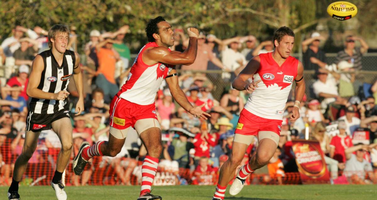 LONG TIME COMING: Sydney Swans' champion Adam Goodes gets a handball away during the pre-season clash against Collingwood at Narrandera Sportsground back in 2007.