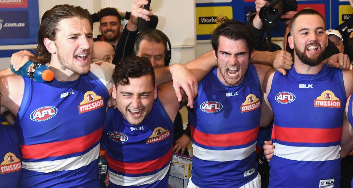 DARE TO DREAM: Matt Suckling (right) celebrates the semi-final win over Hawthorn with his Western Bulldogs' team mates last Friday night. Picture: Getty Images