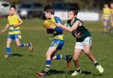 Mangoplah-Cookardinia United-Eastlakes' Thomas Treanor tries to shrug off the tackle of Coolamon's Bryce Robinson in an under 10 game at Mangoplah Sportsground last season. Picture by Les Smith