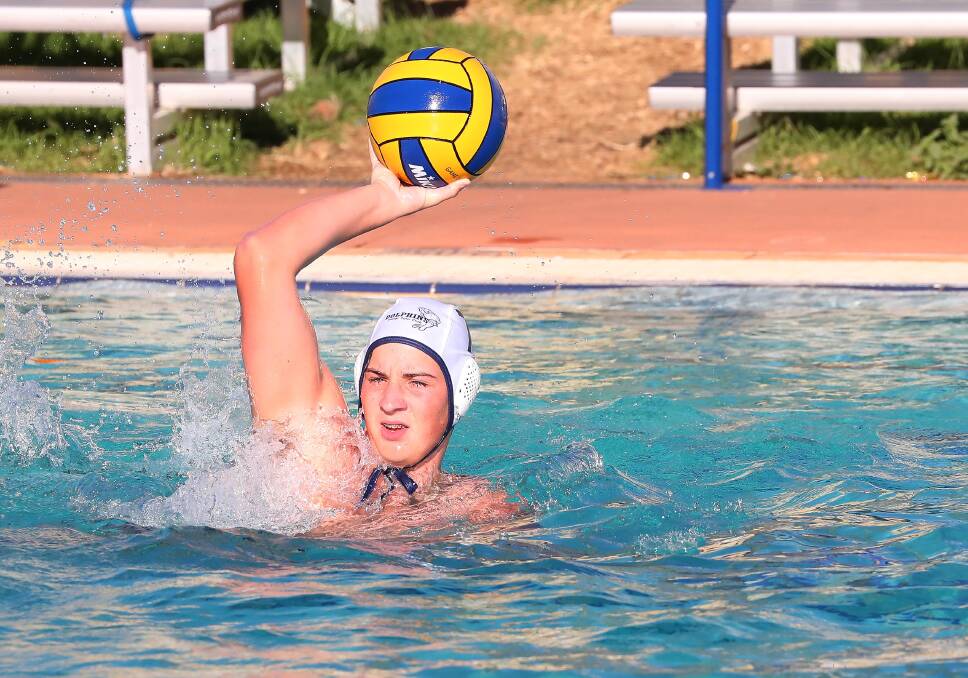 PASSING TRADE: Dolphins' Kolby McMahon looks to pass in the men's A grade water polo game against Raiders on Tuesday night. Picture: Kieren L Tilly
