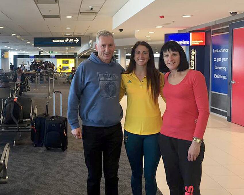 BYE FOR NOW: Wagga rugby sevens star Alicia Quirk with parents Mick and Leanne at Sydney Airport on Tuesday as she prepares to fly out for Rio.